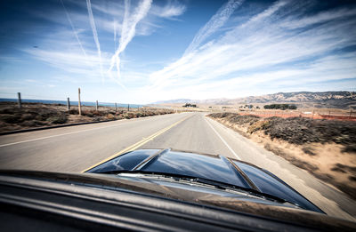 Road seen through car windshield