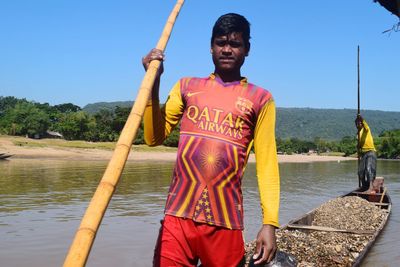 Man standing by river