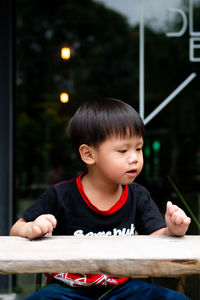 Portrait of boy holding camera