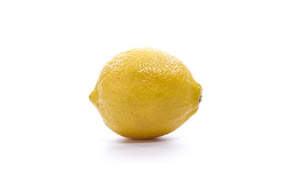 Close-up of lemon slice against white background