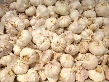 Full frame shot of garlic for sale in market