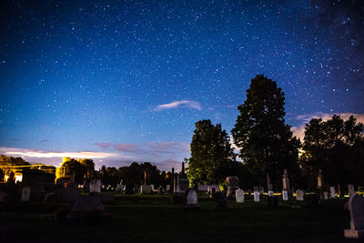 Scenic view of field against sky at night