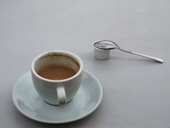 High angle view of coffee cup on table