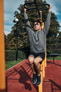 Full length of man exercising in park