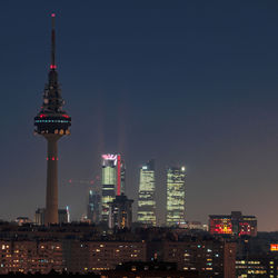 Illuminated buildings in city at night