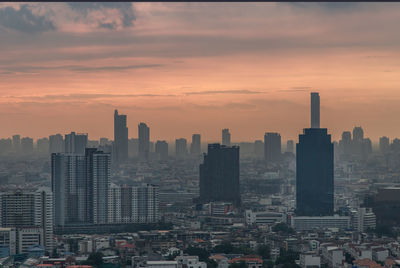 Cityscape against sky during sunset