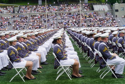 Group of people sitting on chairs