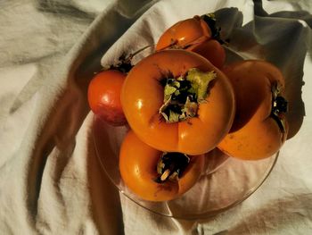 High angle view of orange fruits on table