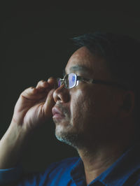 Close-up portrait of man looking away