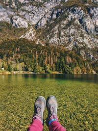 Low section of person by lake