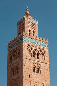Low angle view of historical building against blue sky