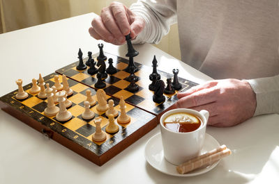 Low angle view of man playing on table