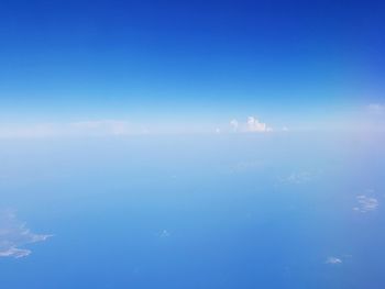 Scenic view of sea against blue sky