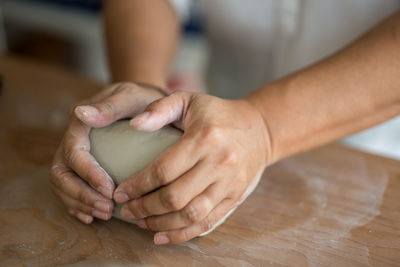 Woman kneading dough