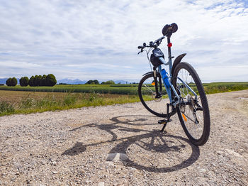 Bicycle on a country road at sunset