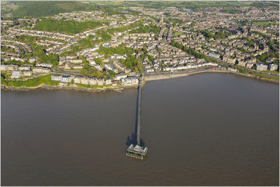 High angle view of city by river