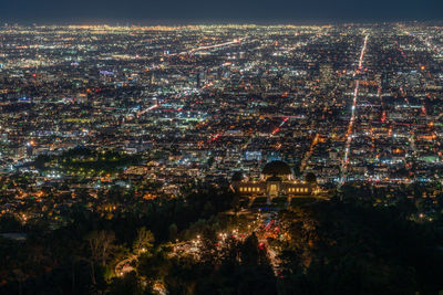 High angle view of illuminated buildings in city at night