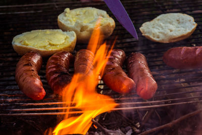 High angle view of meat on barbecue grill