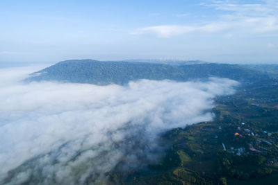 High angle view of sea and mountains against sky