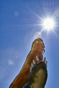 Low angle view of sun shining on sunny day