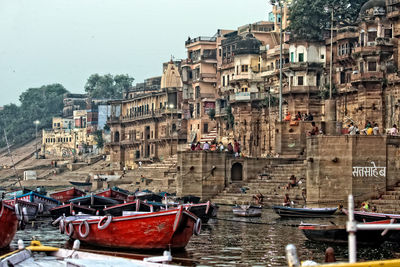 View of boats moored in city