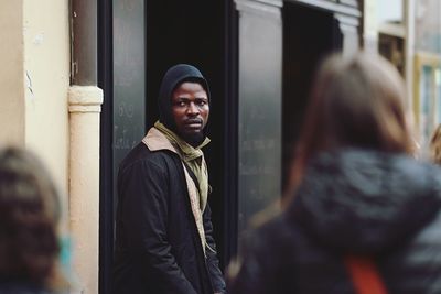 Portrait of young man standing