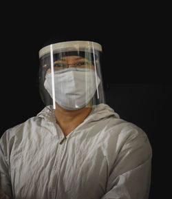 Portrait of a person against black background