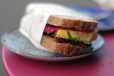 Close-up of fresh sandwich in plate on table