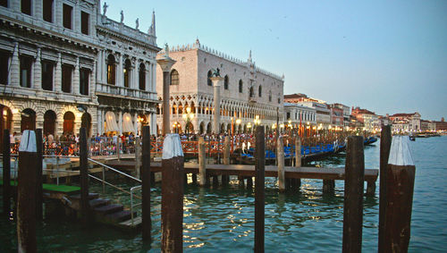 View of boats in canal against buildings