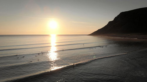 Scenic view of sea against sky during sunset