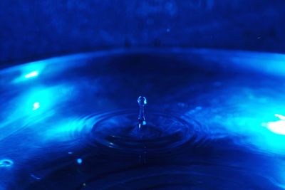 Close-up of drop falling in water