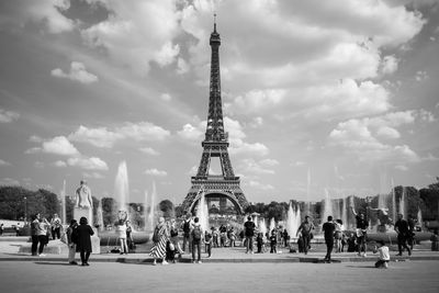 Tourists in front of the eiffel tower, paris, france