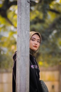 Portrait of woman standing outdoors