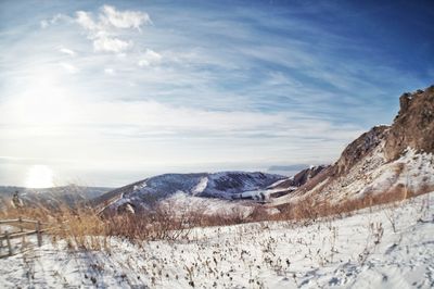 Scenic view of snowcapped mountains against sky