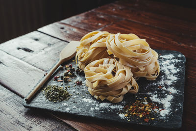 Delicious fresh italian pasta, fettuccini with spices.