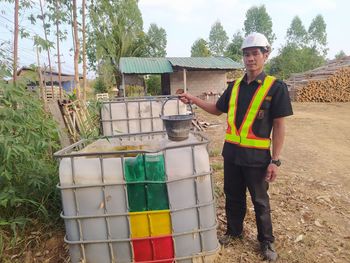 Full length portrait of a man standing outdoors