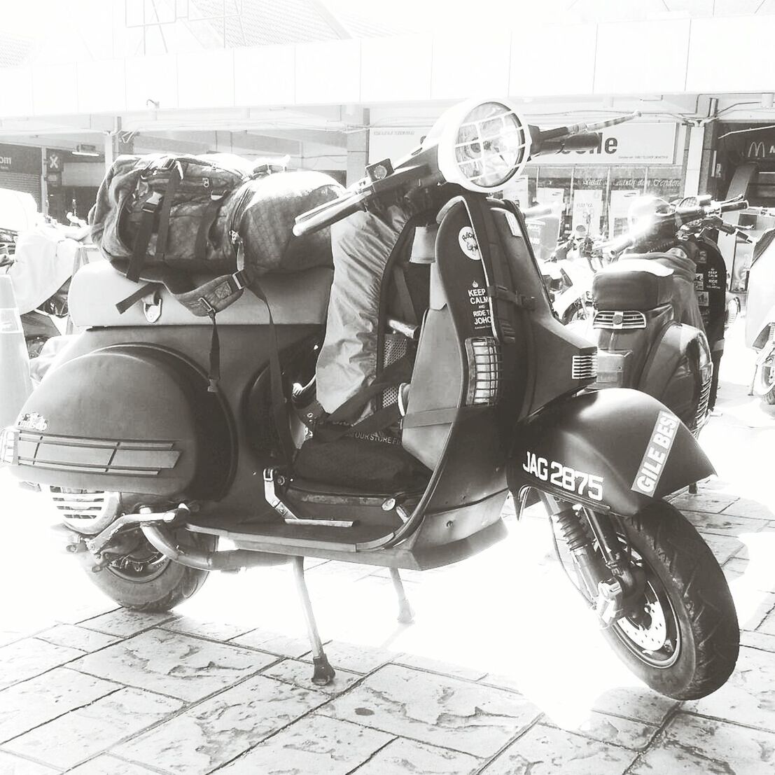 transportation, mode of transport, land vehicle, stationary, car, travel, day, sunlight, parking, metal, parked, outdoors, arts culture and entertainment, chair, street, seat, public transportation, built structure, parking lot, industry