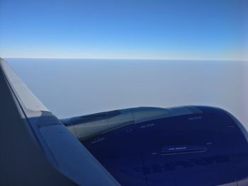 Close-up of airplane against sky