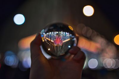 Close-up of hand holding illuminated lights