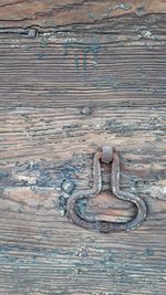 High angle view of old rusty metal door