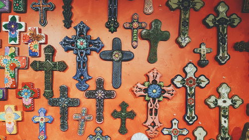 Full frame shot of metal hanging crosses