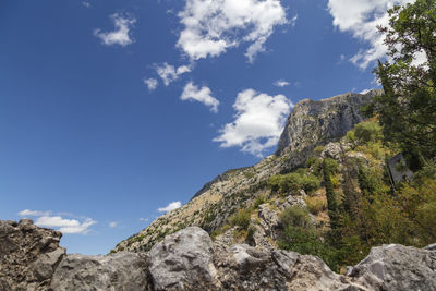 Low angle view of rock formation against sky