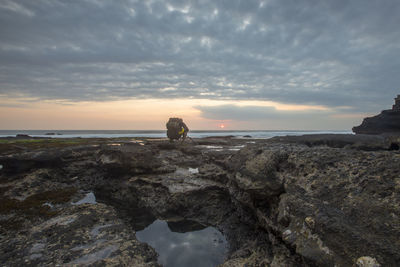 Scenic view of sea against sky at sunset