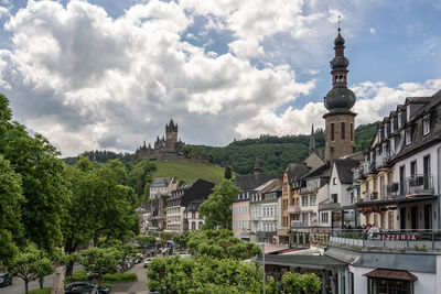 Buildings in city against sky