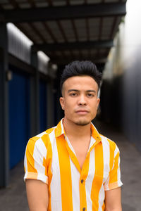 Portrait of young man standing outdoors