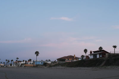 Scenic view of beach against sky during sunset