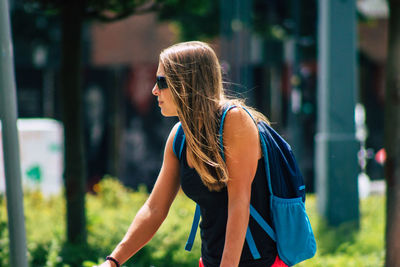 Woman wearing sunglasses standing outdoors