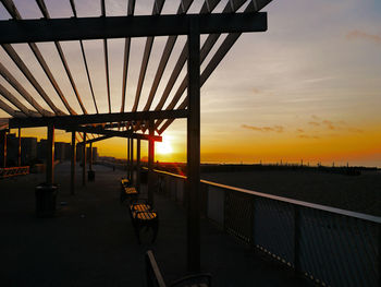 Silhouette bridge against sky during sunset