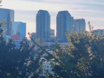 Modern buildings in city against sky