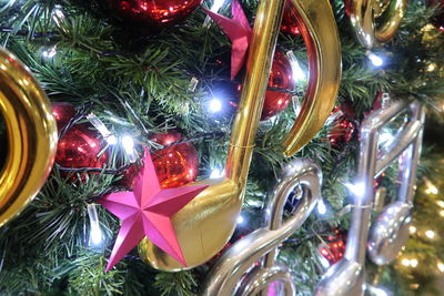 Close-up of illuminated christmas tree at night